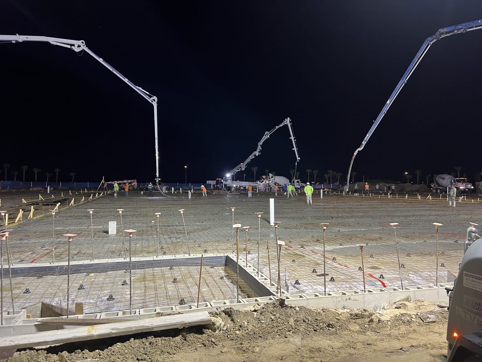 Stem-wall and footing forms with rebar staged for a foundation pour
