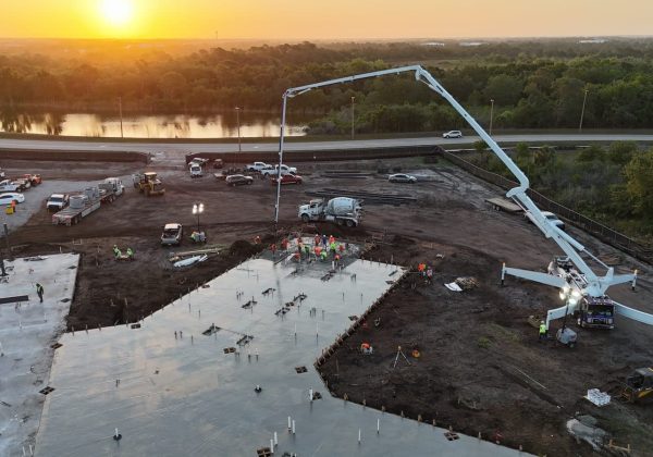 Golden-hour commercial concrete pour with a pump truck in Southwest Florida